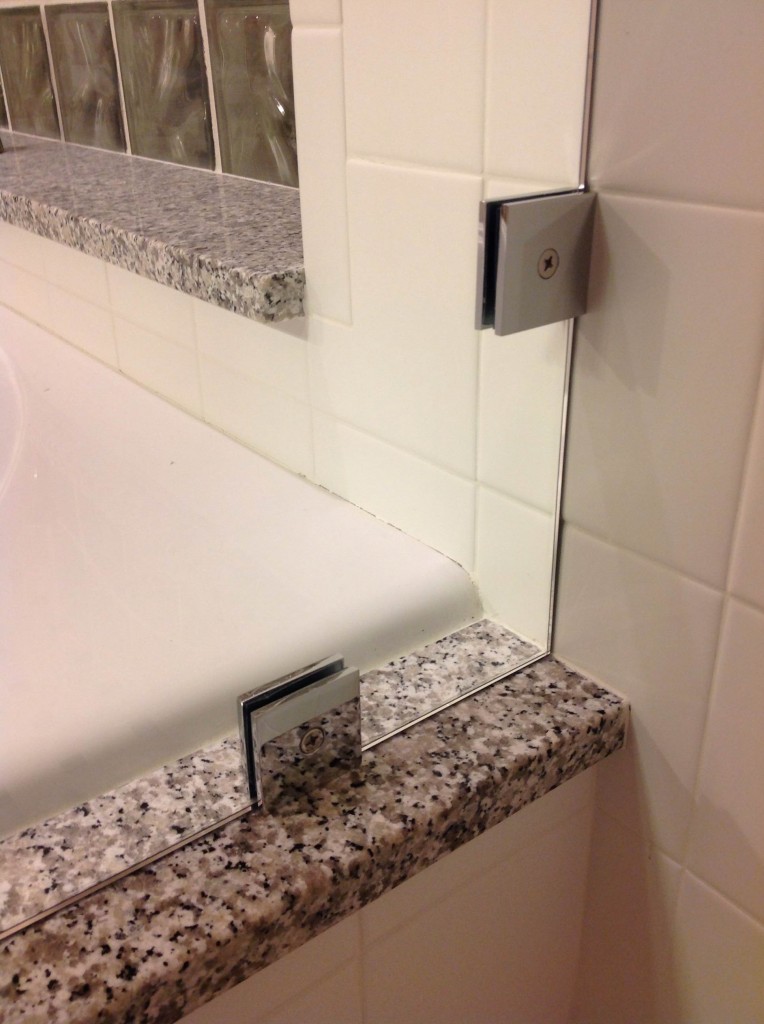 Vienna Style Clips Securing Return Panel On Frameless Shower Enclosure Featured On Hgtv S